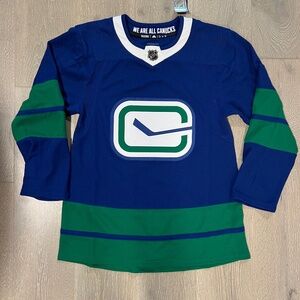 Vancouver Canucks third jersey stick in rink